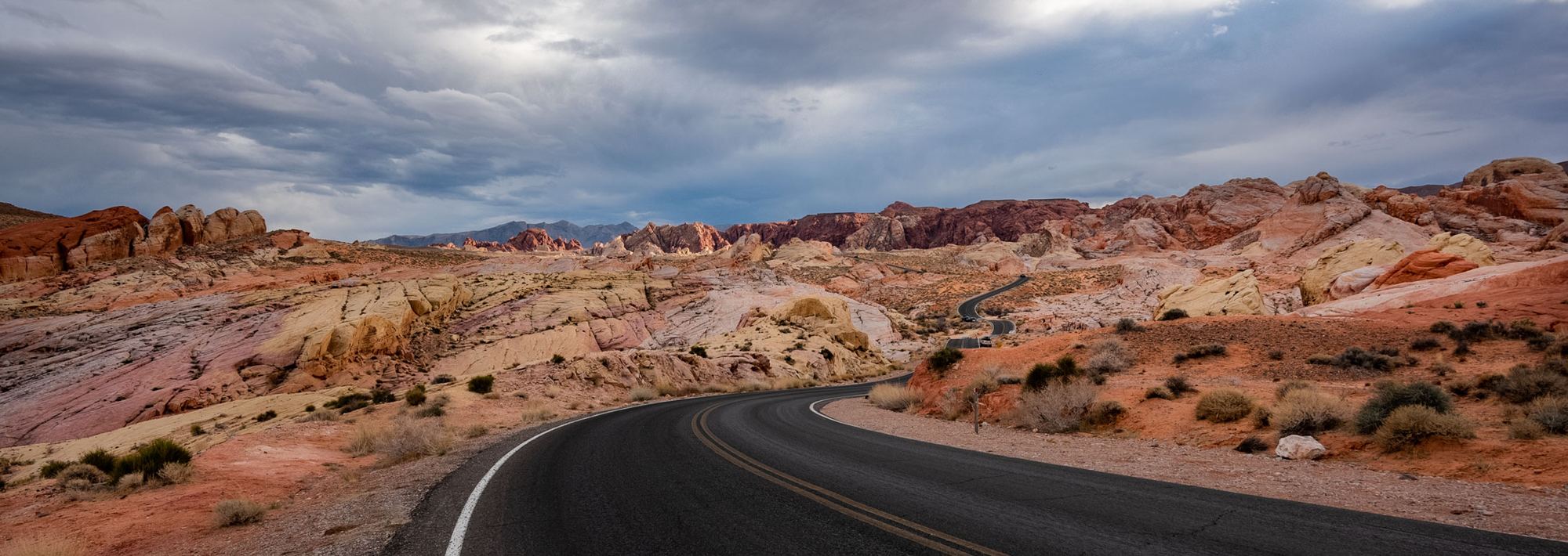 Road winding through Valley of Fire's red rock, photographed by Michael Klinger