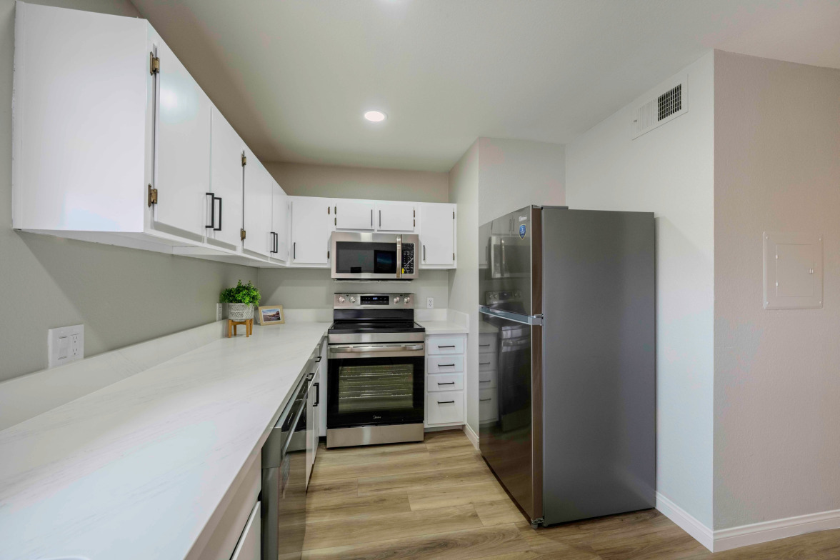 Galley kitchen with quartz counters — 1303 Darlene Way Unit 301C, Boulder City, NV
